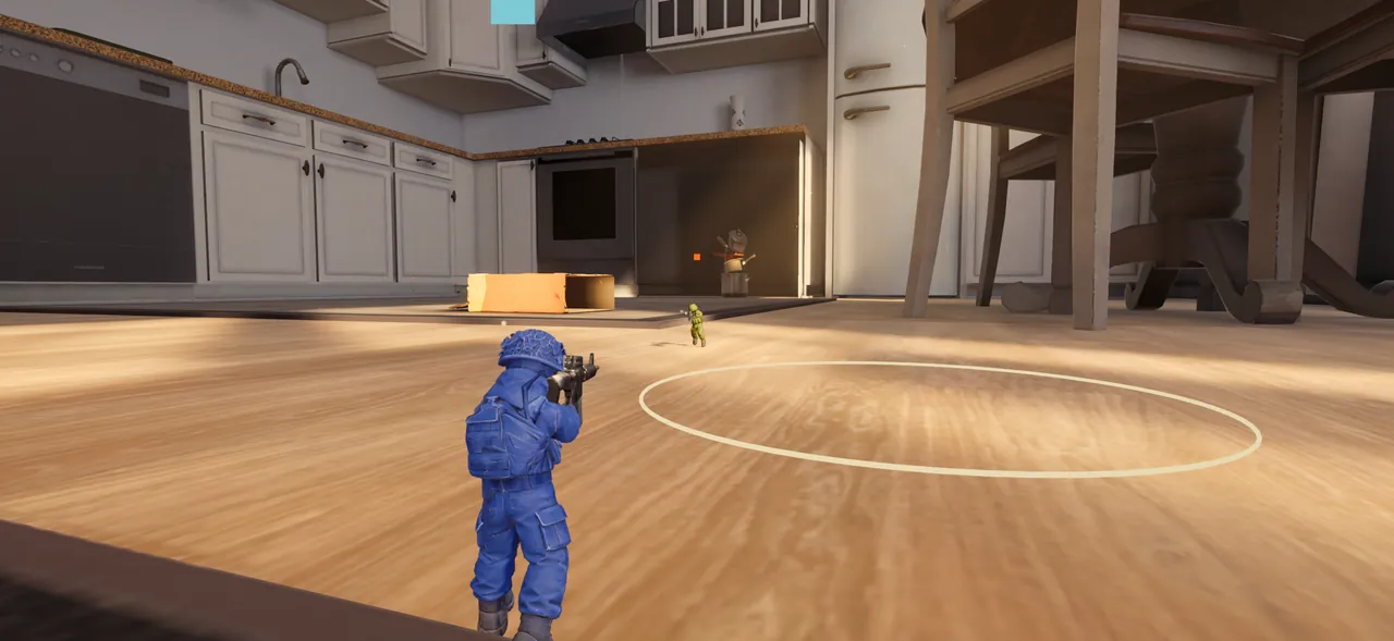 A blue toy soldier aims across the sunlit kitchen floor at the enemy near the capture ring